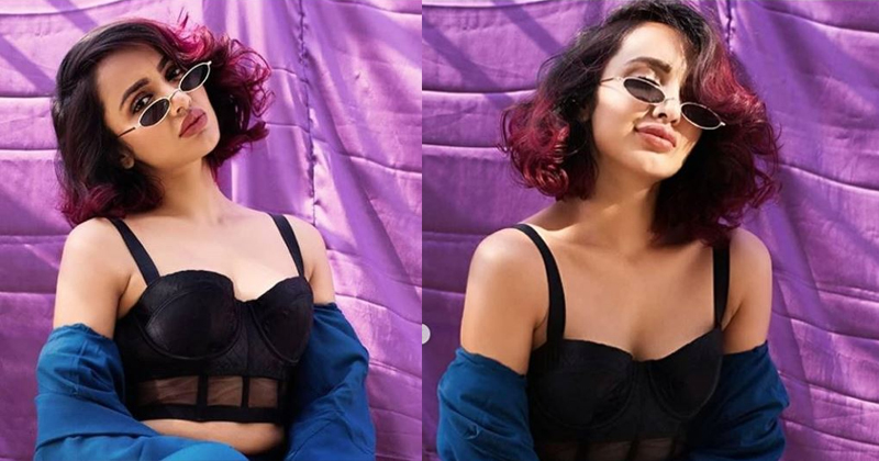 షర్ట్ విప్పేసి లోపలి అందాల ప్రదర్శన..ఆ బ్యూటీ పాట్లు దేనికి?