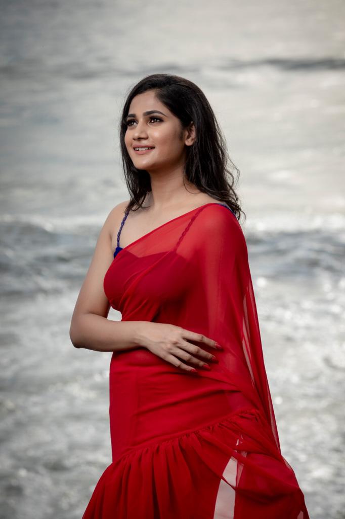 Losliya Red Saree New photos Losliya Red Saree New photos