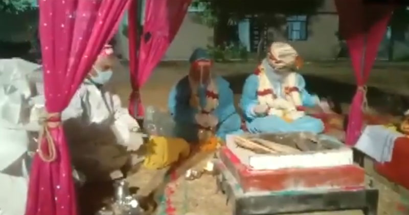 వ‌ధు‌వుకు క‌రోనా.. పీపీఈ కిట్‌లు ధ‌రించి పెళ్లి జ‌రిపించిన పూజారులు