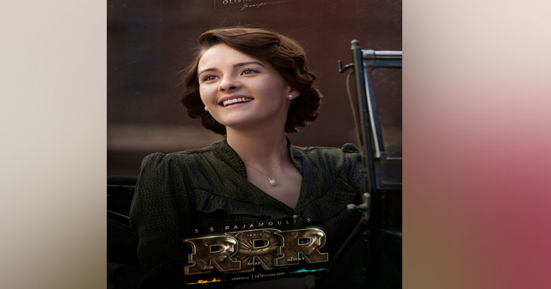 ఎన్టీఆర్ స‌ర‌స‌న ఒలీవియా మోరిస్.. ఫ‌స్ట్ లుక్‌తో అంచ‌నాలు పెంచిన రాజ‌మౌళి