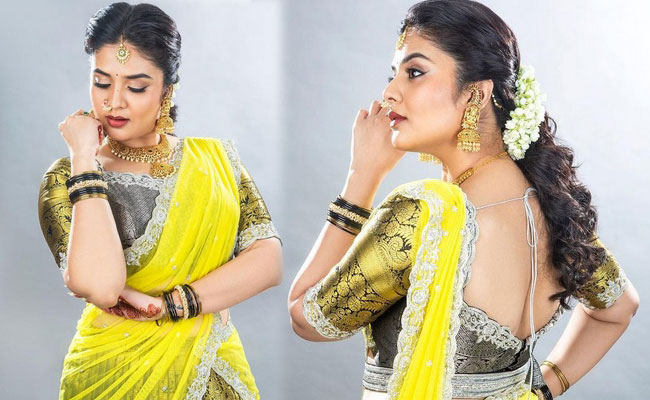 Sreemukhi New Stills in Yellow Half Saree