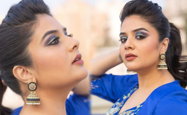 Sreemukhi Gorgeous Stills in Blue Dress